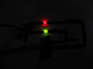 First paper/glue circuit powered with lights off.